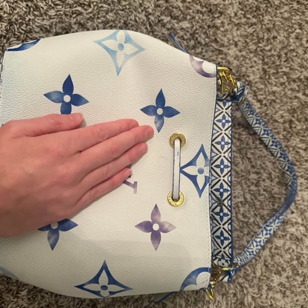 Blue Logo Bucket Bag selling as is, some paint/ink on bag